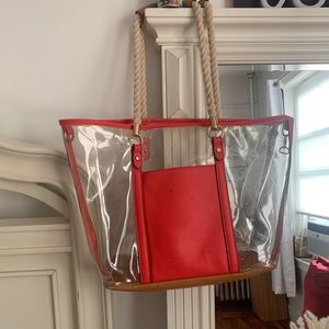 Clear plastic bag with q red pocket